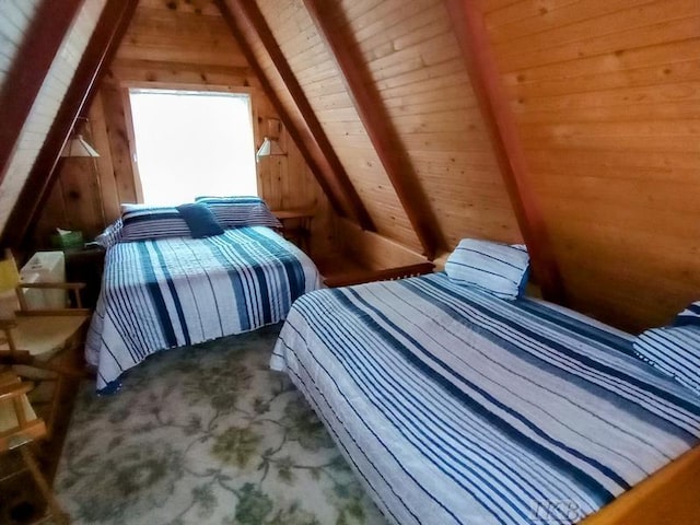 bedroom featuring wooden walls, vaulted ceiling, and wooden ceiling