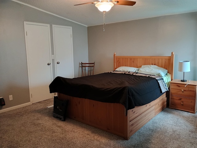 bedroom with crown molding, a ceiling fan, vaulted ceiling, and light carpet