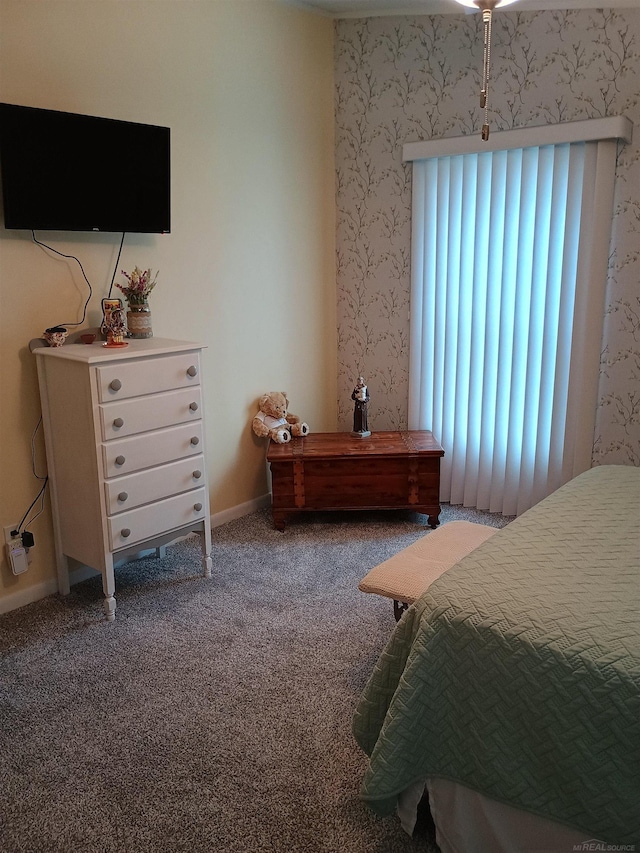 bedroom with carpet floors, baseboards, and wallpapered walls