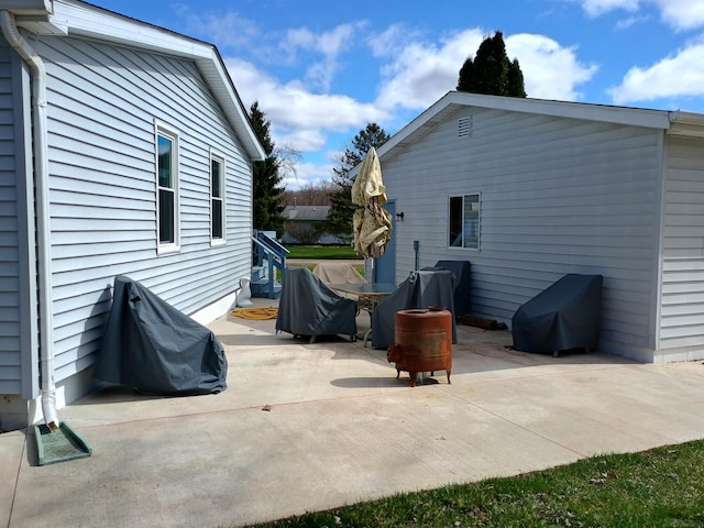 view of patio featuring grilling area and outdoor dining area