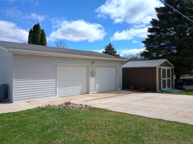 detached garage featuring a storage unit