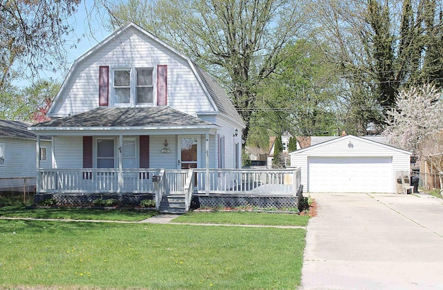 colonial inspired home with an outdoor structure, a gambrel roof, covered porch, and a detached garage