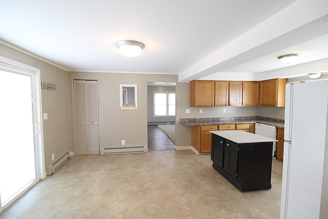 kitchen featuring white appliances, a baseboard heating unit, and a center island