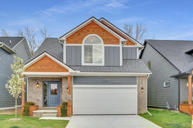 craftsman-style home with board and batten siding, a garage, brick siding, concrete driveway, and a shingled roof