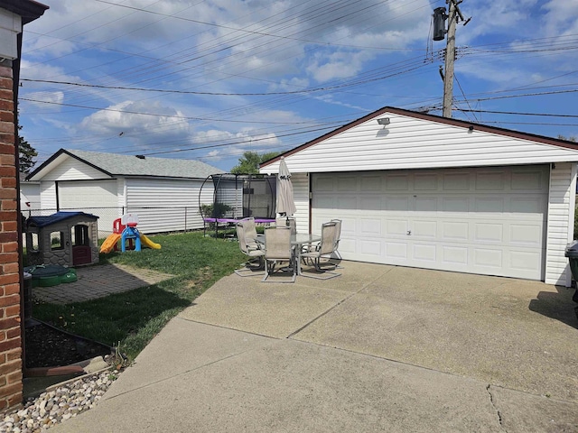 detached garage featuring a trampoline