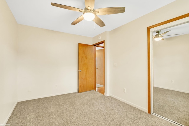 unfurnished bedroom with carpet floors, baseboards, a closet, and ceiling fan