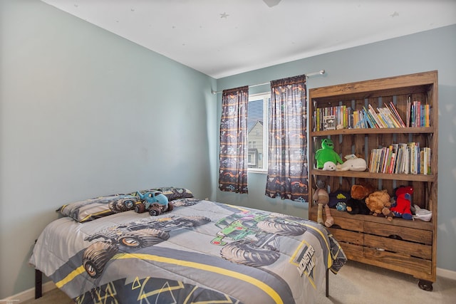 bedroom with baseboards and carpet flooring