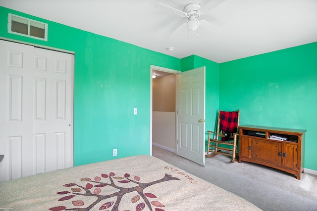 bedroom featuring visible vents, a ceiling fan, carpet, and baseboards