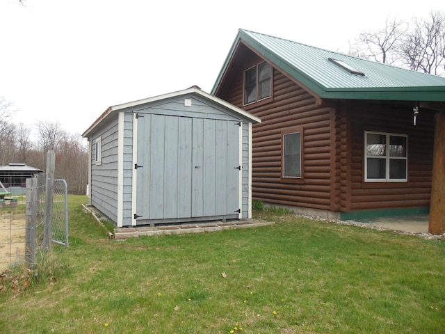 view of shed featuring fence