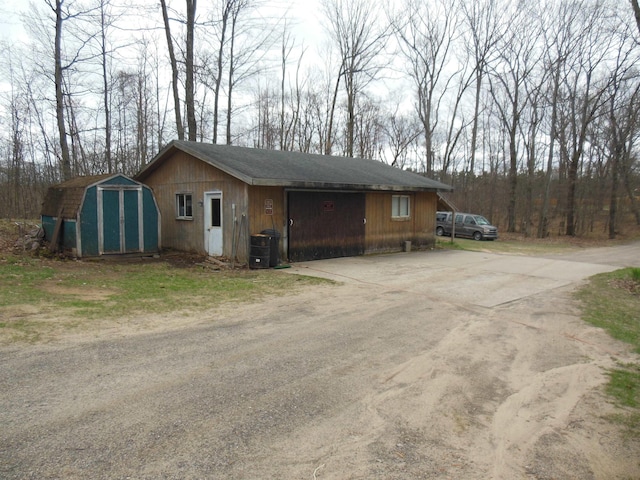 exterior space featuring central AC and driveway