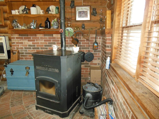 interior details featuring heating unit and a wood stove