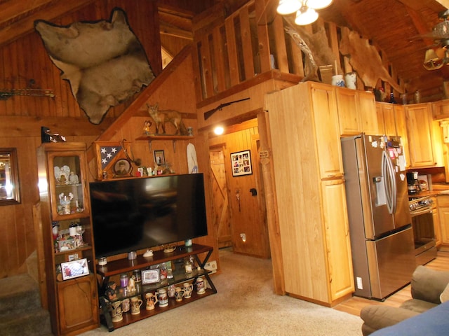 living room featuring wooden walls, high vaulted ceiling, light colored carpet, and wood ceiling