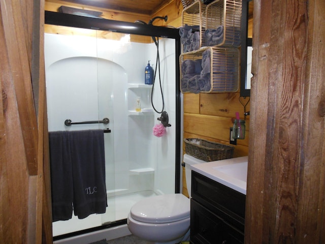 full bath with vanity, toilet, and a stall shower