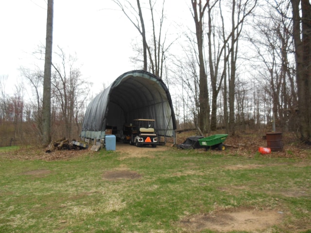 view of outbuilding featuring a carport