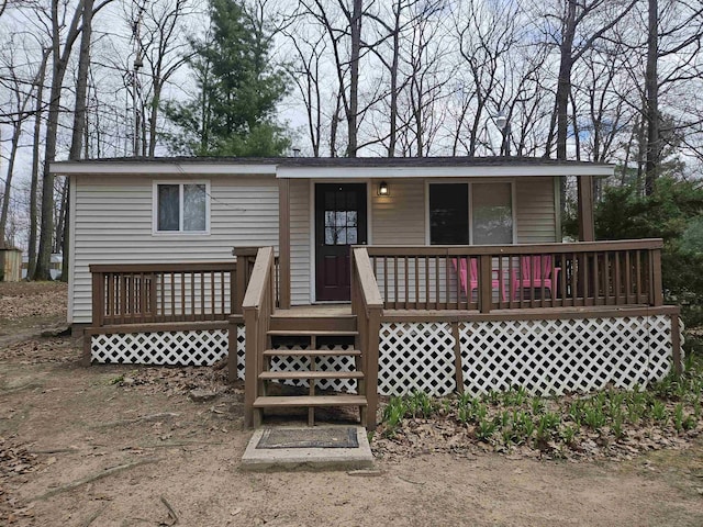 view of front of property with a wooden deck