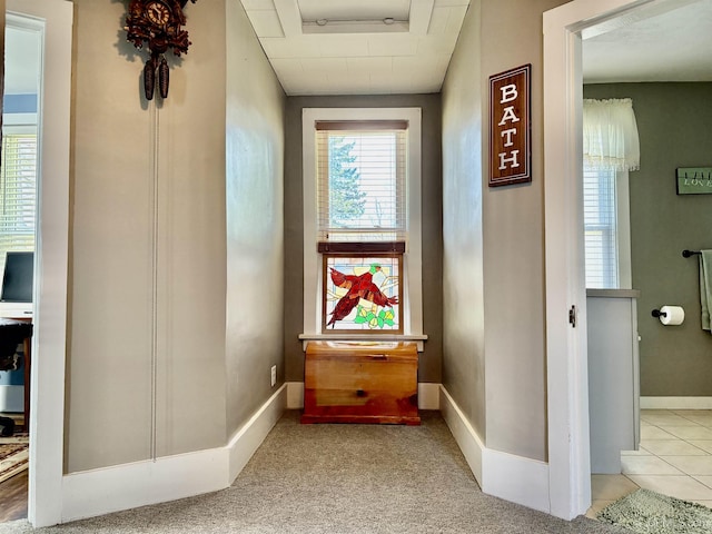 corridor featuring baseboards