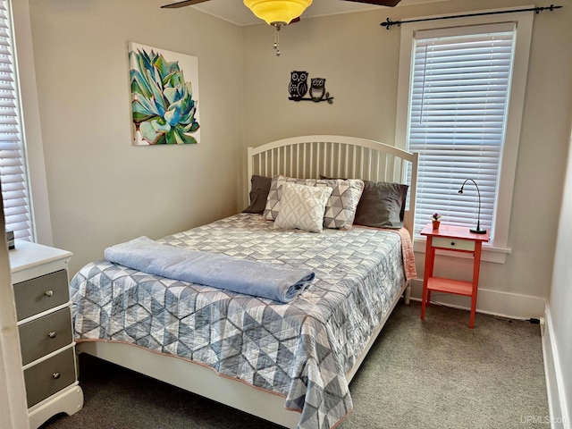 bedroom with carpet floors, a ceiling fan, baseboards, and crown molding