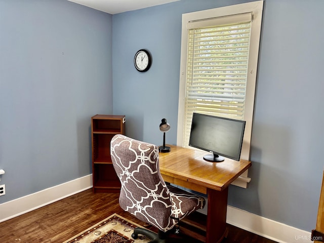 office space with baseboards and wood finished floors