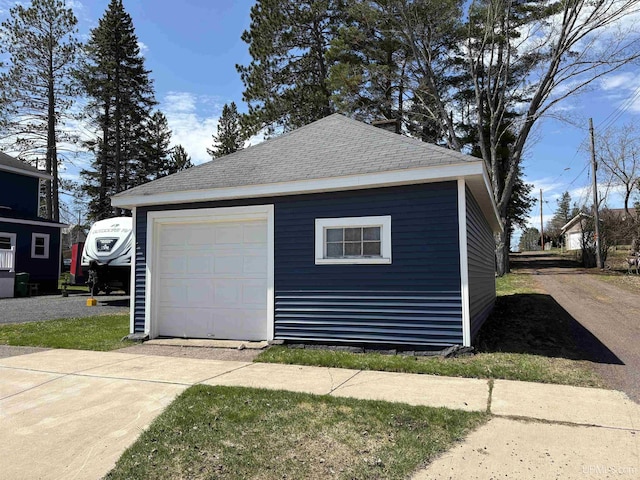 garage featuring driveway