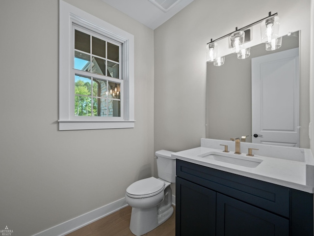 3251 Waldon Ridge Dr, Orion Twp, MI 48359 - half bathroom with vanity, toilet, wood finished floors, and baseboards