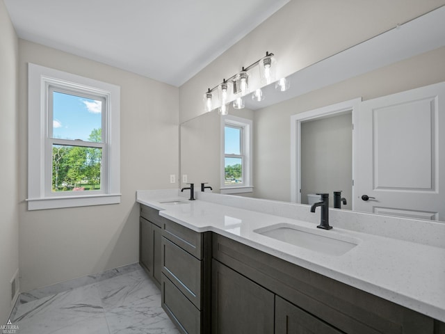 3251 Waldon Ridge Dr, Orion Twp, MI 48359 - bathroom with double vanity, healthy amount of natural light, marble finish flooring, and baseboards