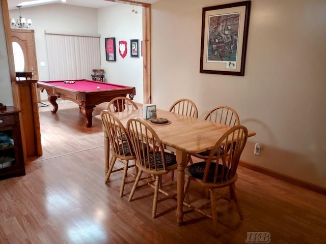 dining space with pool table, baseboards, and light wood finished floors