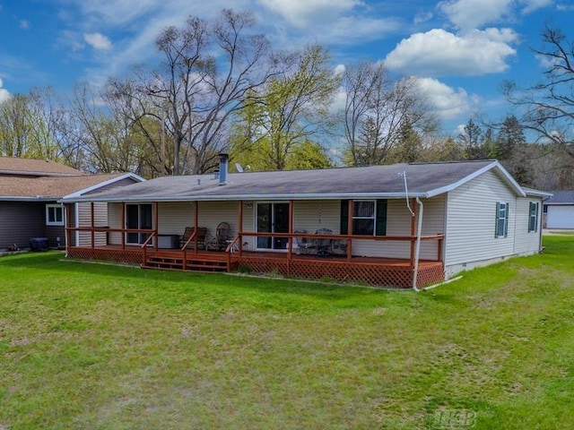 rear view of property with a lawn and crawl space