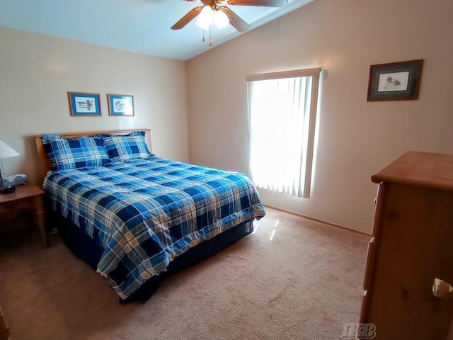 bedroom with carpet floors, baseboards, vaulted ceiling, and ceiling fan
