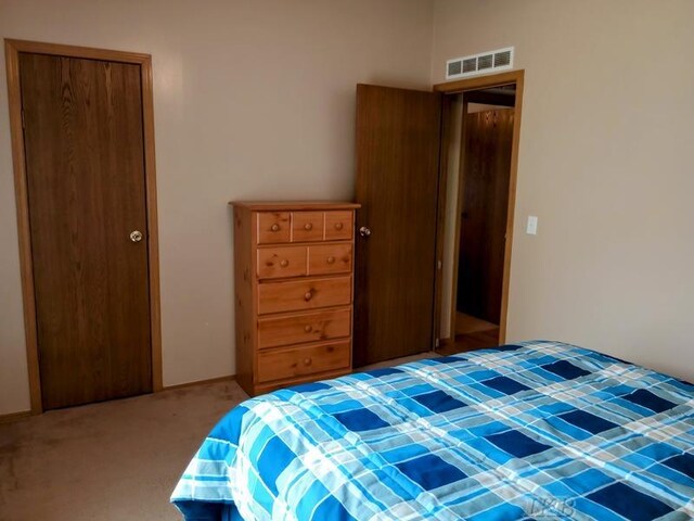 carpeted bedroom with visible vents