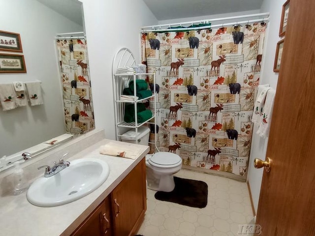 full bath featuring toilet, tile patterned floors, a shower with shower curtain, and vanity