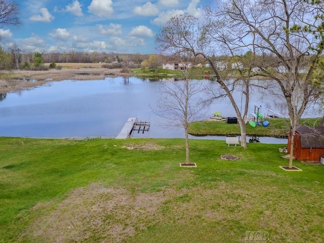 exterior space featuring a water view and a dock