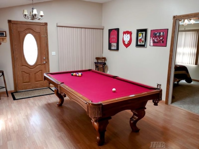 playroom featuring an inviting chandelier, pool table, and wood finished floors