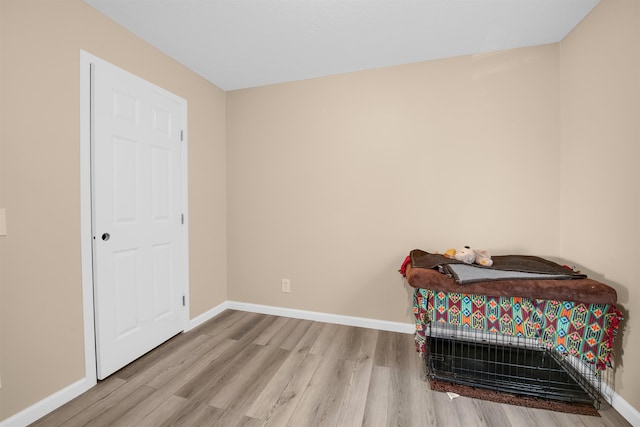 3160 Highland Pkwy, Gladwin, MI 48624 - bedroom with baseboards and wood finished floors