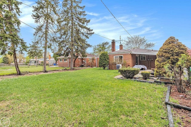 view of yard with fence