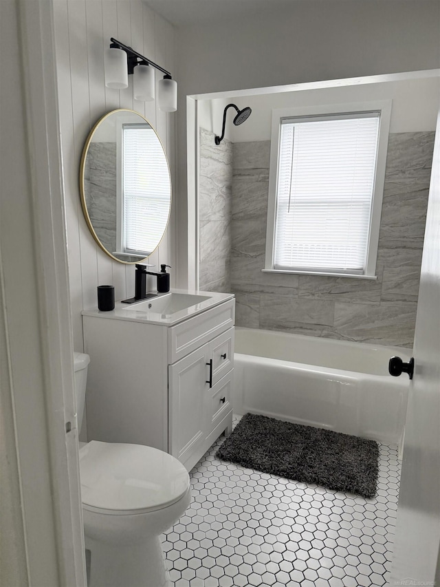 bathroom featuring vanity, shower / bathtub combination, tile patterned floors, and toilet