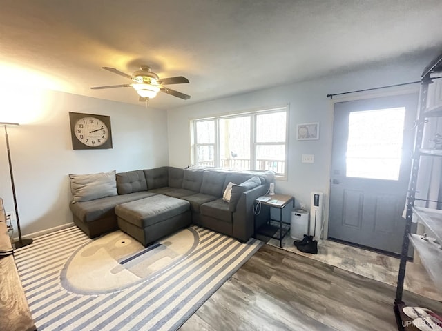 131 Midway Dr, Negaunee, MI 49866 - living room featuring ceiling fan and wood finished floors