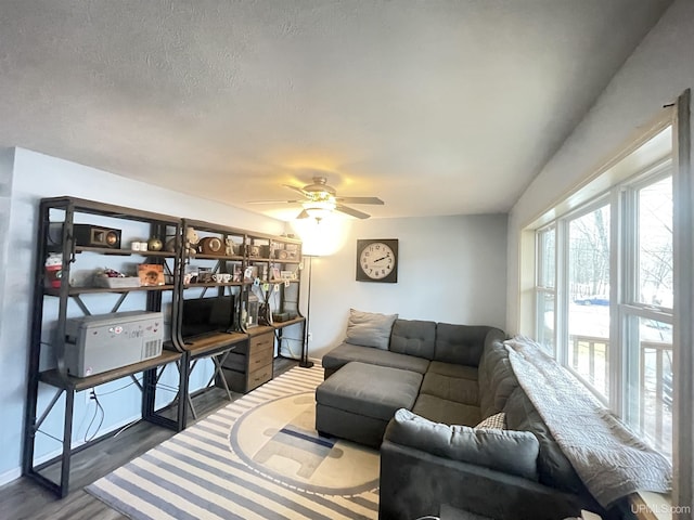 131 Midway Dr, Negaunee, MI 49866 - living room featuring ceiling fan, dark wood-style flooring, and baseboards