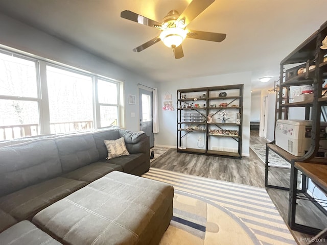 131 Midway Dr, Negaunee, MI 49866 - living room with ceiling fan, wood finished floors, and baseboards