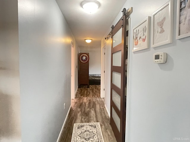 131 Midway Dr, Negaunee, MI 49866 - hallway with dark wood finished floors and a barn door