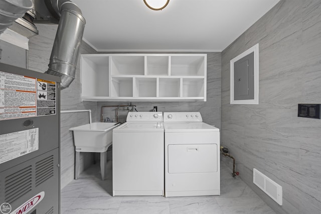 clothes washing area featuring washing machine and clothes dryer, laundry area, marble finish floor, visible vents, and electric panel