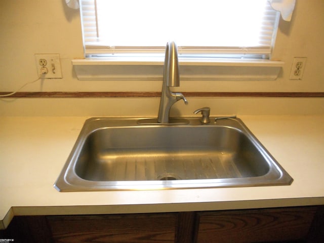 room details featuring light countertops and a sink