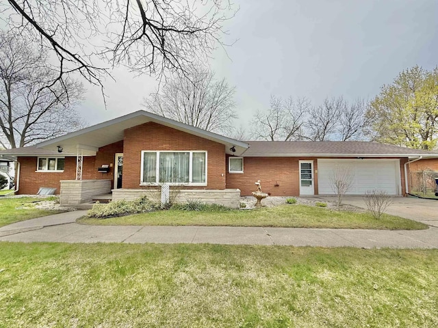single story home featuring an attached garage, driveway, and brick siding