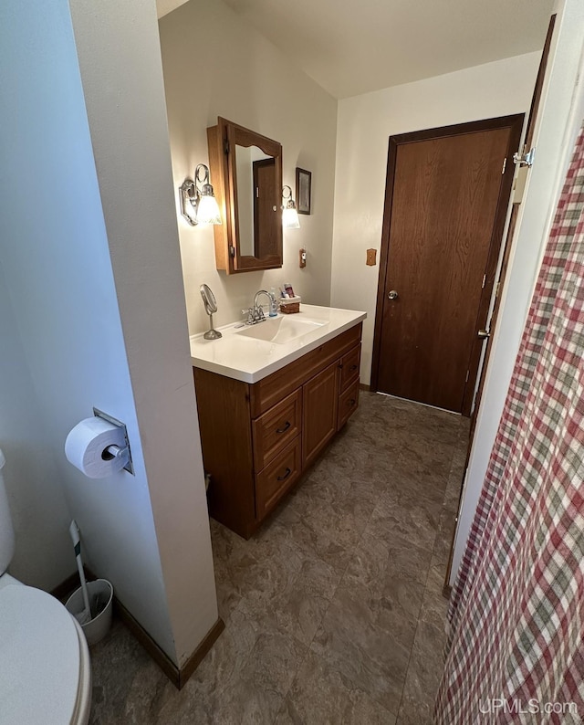 full bathroom with vanity and toilet