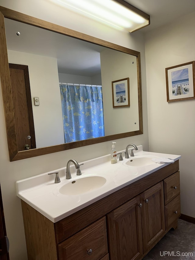 full bath featuring double vanity and a sink