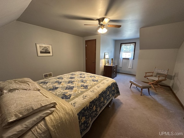 carpeted bedroom featuring baseboards, ceiling fan, lofted ceiling, and visible vents