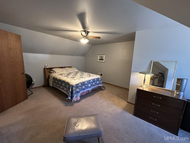 carpeted bedroom featuring ceiling fan, visible vents, and lofted ceiling