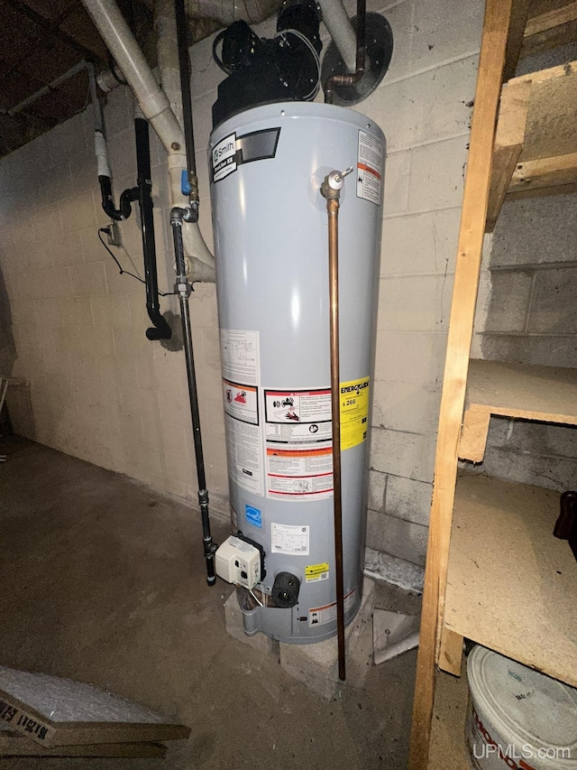utility room featuring water heater