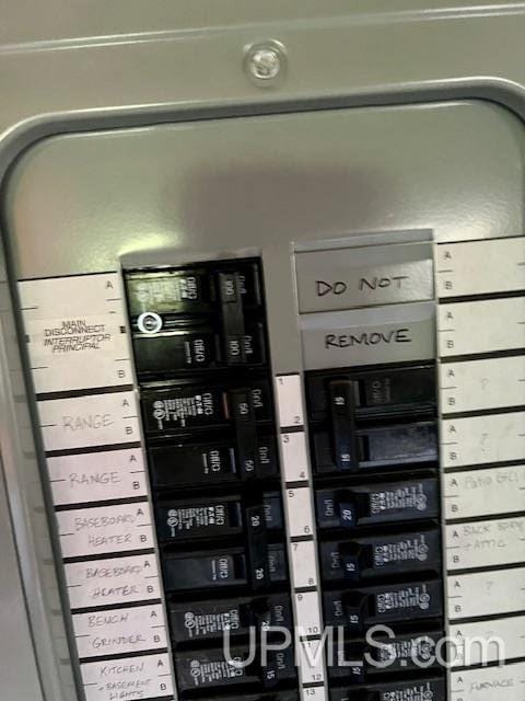 utility room featuring electric panel