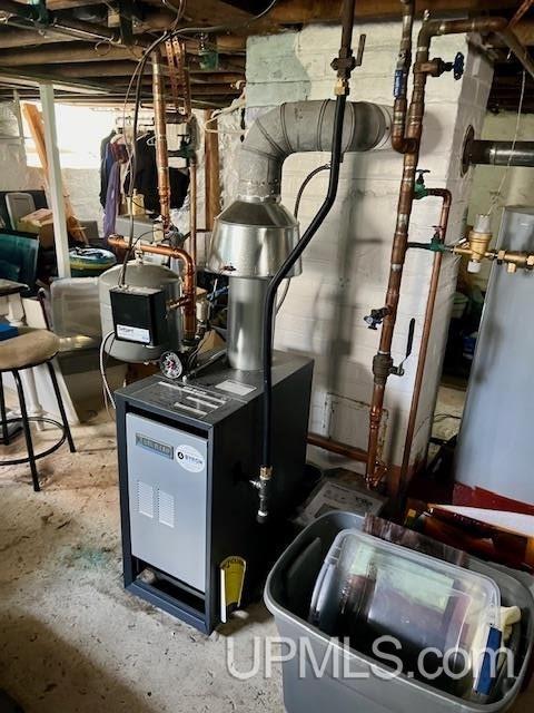 utility room featuring a heating unit
