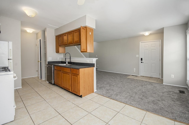 kitchen featuring light carpet, a sink, white appliances, light tile patterned floors, and visible vents